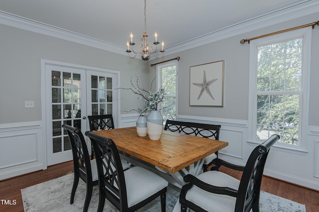 301 Grove Hall Ln, Mebane, NC 27302 - dining space with a chandelier, ornamental molding, dark wood-style flooring, a wainscoted wall, and french doors