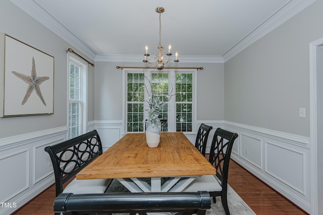 301 Grove Hall Ln, Mebane, NC 27302 - dining area with a chandelier, crown molding, wainscoting, dark wood finished floors, and a decorative wall