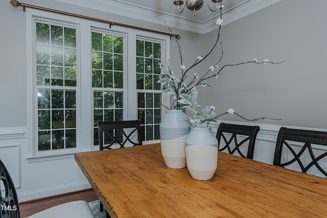301 Grove Hall Ln, Mebane, NC 27302 - dining space with crown molding, a chandelier, and wood finished floors