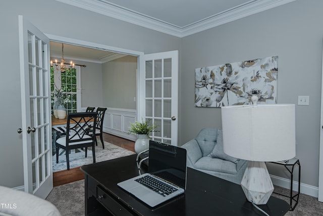 301 Grove Hall Ln, Mebane, NC 27302 - living area featuring french doors, a chandelier, ornamental molding, and a wainscoted wall