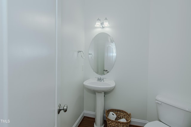 301 Grove Hall Ln, Mebane, NC 27302 - half bath with toilet and wood finished floors