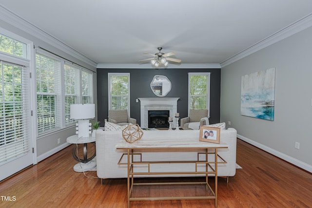 301 Grove Hall Ln, Mebane, NC 27302 - living room with wood finished floors, ceiling fan, a fireplace, crown molding, and plenty of natural light