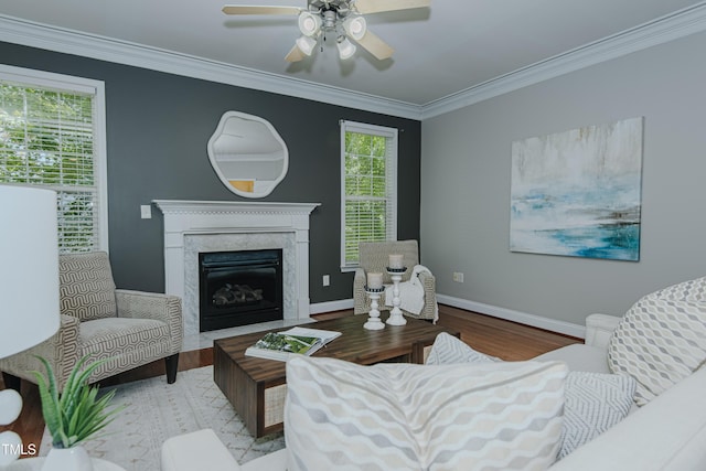 301 Grove Hall Ln, Mebane, NC 27302 - living area with wood finished floors, ornamental molding, ceiling fan, and a fireplace
