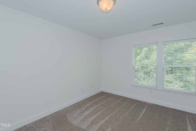 301 Grove Hall Ln, Mebane, NC 27302 - carpeted spare room featuring baseboards