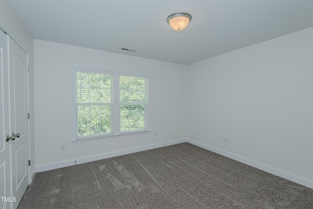 301 Grove Hall Ln, Mebane, NC 27302 - unfurnished room with plenty of natural light and dark colored carpet