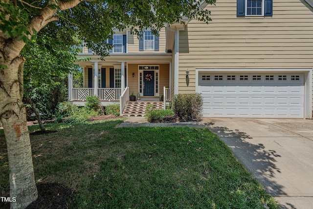 301 Grove Hall Ln, Mebane, NC 27302 - traditional-style home featuring concrete driveway, a porch, a garage, and a front yard