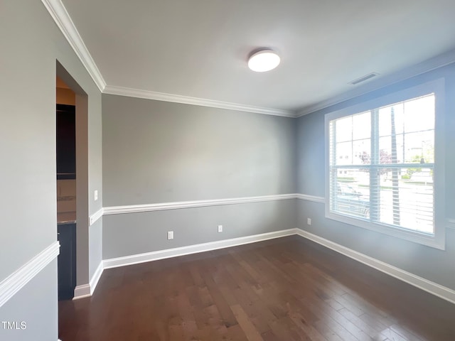 607 Finnbar Dr, Cary, NC 27519 - spare room featuring dark wood-type flooring and ornamental molding