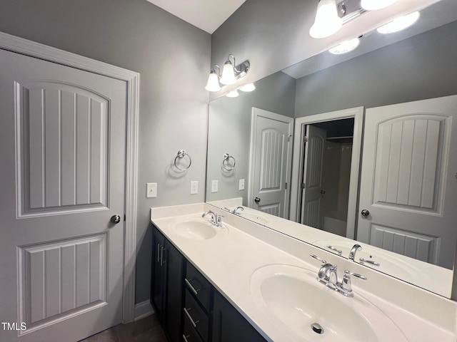607 Finnbar Dr, Cary, NC 27519 - bathroom with double vanity and tile patterned floors