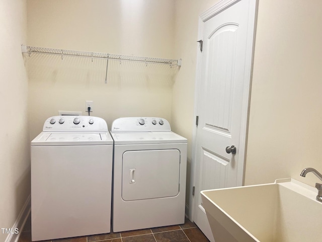 607 Finnbar Dr, Cary, NC 27519 - laundry room with washer and dryer and dark tile patterned flooring