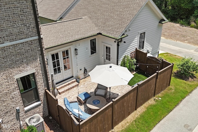 930 Watercolor Way, Durham, NC 27713 - rear view of property featuring french doors, a shingled roof, an outdoor living space, and a patio