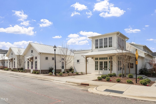930 Watercolor Way, Durham, NC 27713 - view of front of home featuring french doors and a metal roof