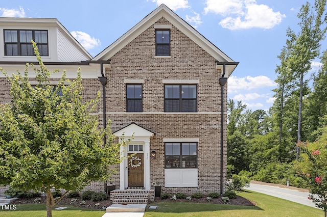 930 Watercolor Way, Durham, NC 27713 - view of front of property with brick siding and a front yard