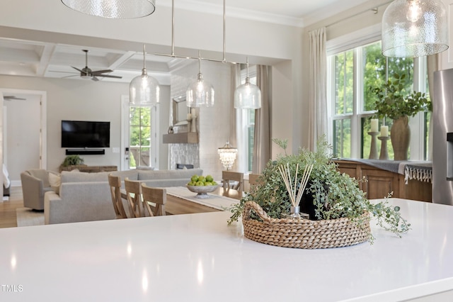 930 Watercolor Way, Durham, NC 27713 - kitchen with ceiling fan, coffered ceiling, beamed ceiling, open floor plan, and light countertops