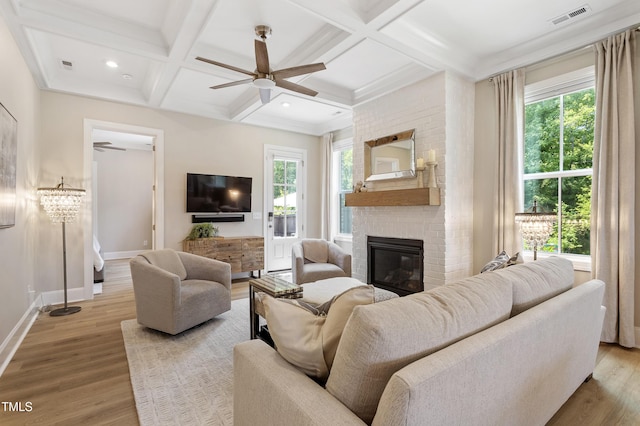 930 Watercolor Way, Durham, NC 27713 - living room featuring a fireplace, ceiling fan, coffered ceiling, wood finished floors, and beam ceiling