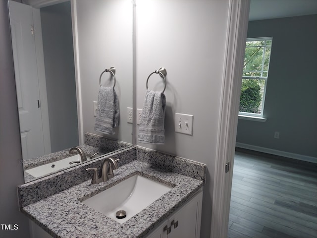 408 Timpson Ave, Durham, NC 27703 - bathroom featuring vanity and wood finished floors