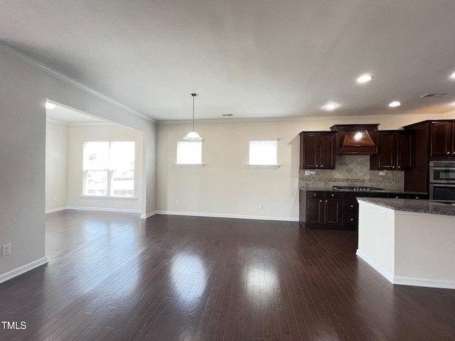 1521 Kythira Dr, Apex, NC 27502 - kitchen with premium range hood, crown molding, dark brown cabinets, decorative backsplash, and dark wood-style flooring