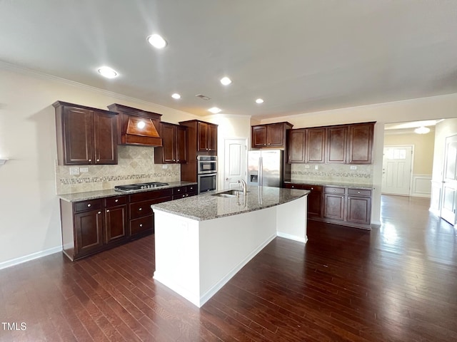 1521 Kythira Dr, Apex, NC 27502 - kitchen featuring appliances with stainless steel finishes, ornamental molding, dark wood-style flooring, custom range hood, and backsplash