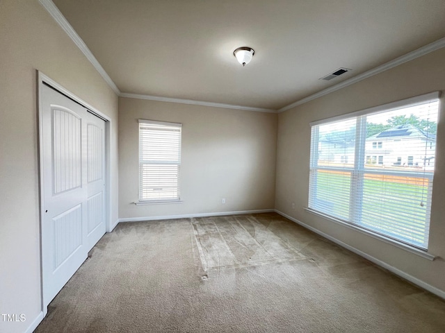 1521 Kythira Dr, Apex, NC 27502 - unfurnished bedroom featuring carpet floors, crown molding, and a closet