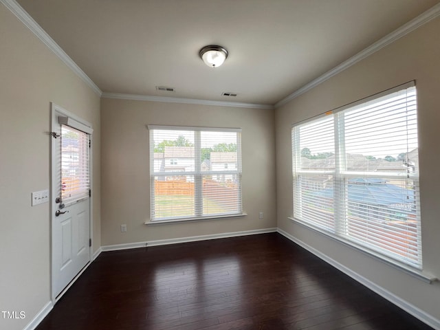 1521 Kythira Dr, Apex, NC 27502 - empty room featuring plenty of natural light, crown molding, and dark wood finished floors