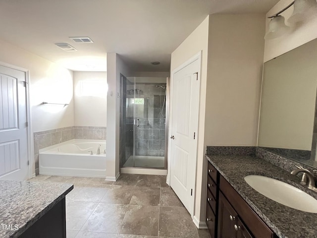 1521 Kythira Dr, Apex, NC 27502 - bathroom featuring vanity, a stall shower, a garden tub, and tile patterned flooring