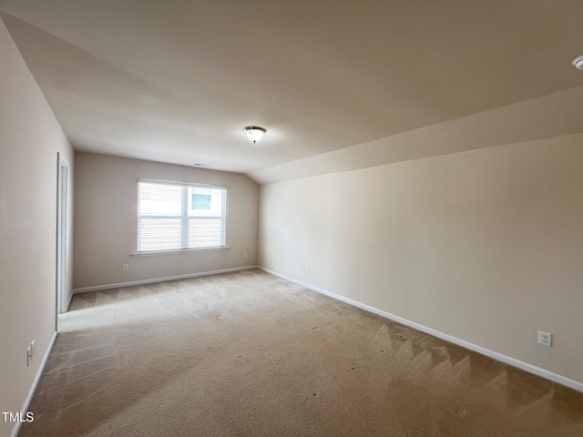 1521 Kythira Dr, Apex, NC 27502 - spare room with light colored carpet and lofted ceiling