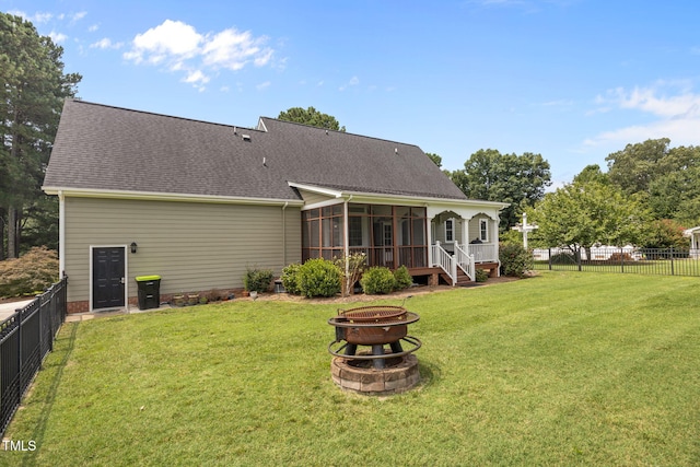 2424 Village Of Wakefield Dr, Zebulon, NC 27597 - back of house with a fire pit, a sunroom, a fenced backyard, and a shingled roof