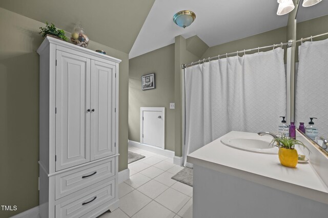 2424 Village Of Wakefield Dr, Zebulon, NC 27597 - bathroom with tile patterned floors, vanity, and vaulted ceiling