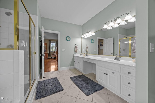 2424 Village Of Wakefield Dr, Zebulon, NC 27597 - bathroom with double vanity, a stall shower, tile patterned floors, and ensuite bathroom