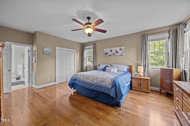2424 Village Of Wakefield Dr, Zebulon, NC 27597 - bedroom featuring light wood-type flooring, multiple windows, a closet, and ceiling fan