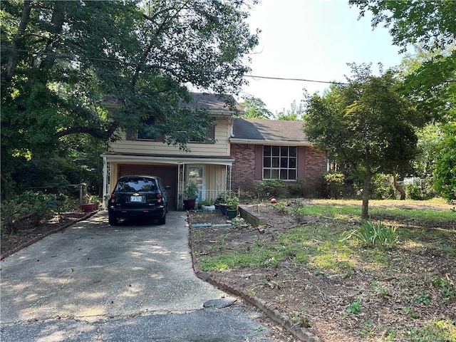 1404 Faye Ave, Spring Lake, NC 28390 - tri-level home with a garage, driveway, and brick siding