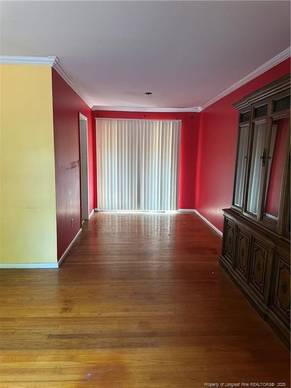 1404 Faye Ave, Spring Lake, NC 28390 - spare room with wood finished floors and ornamental molding