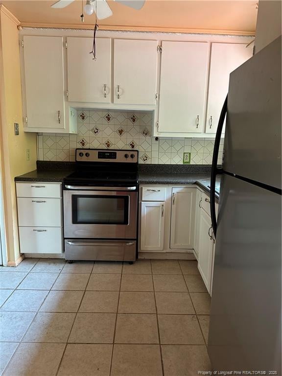 1404 Faye Ave, Spring Lake, NC 28390 - kitchen with freestanding refrigerator, stainless steel range with electric cooktop, dark countertops, and tasteful backsplash