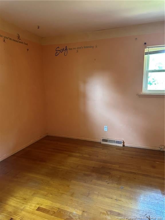 1404 Faye Ave, Spring Lake, NC 28390 - unfurnished room with light wood-type flooring and baseboards