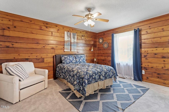7323 Powell Hooks Rd, Lucama, NC 27851 - carpeted bedroom with wood walls, a textured ceiling, and ceiling fan