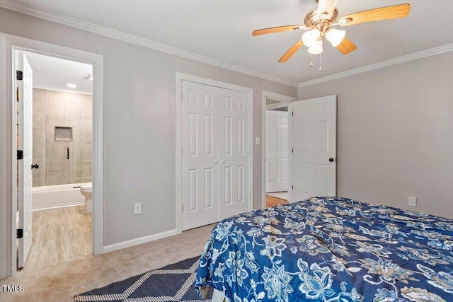 7323 Powell Hooks Rd, Lucama, NC 27851 - carpeted bedroom with crown molding, a closet, connected bathroom, and a ceiling fan