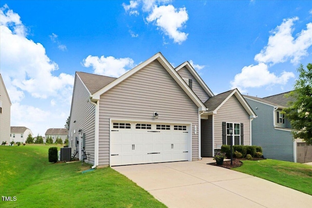 56 E Copenhaver Dr, Clayton, NC 27527 - view of front of home with an attached garage, concrete driveway, and a front yard