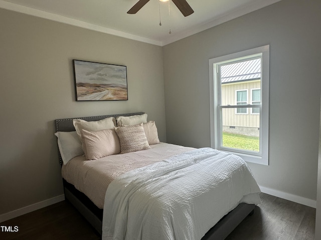 1849 N Main St, Roxboro, NC 27573 - bedroom with dark wood-style flooring, ornamental molding, and a ceiling fan