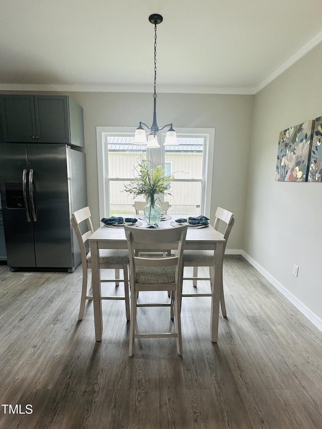 1849 N Main St, Roxboro, NC 27573 - dining space with ornamental molding, dark wood-style floors, and a chandelier