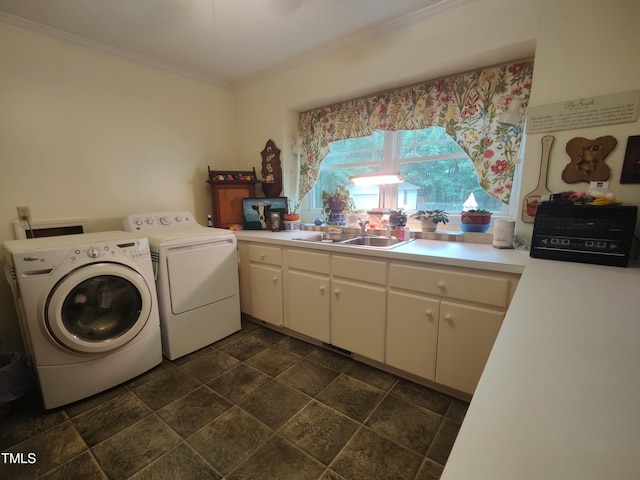 6517 Whitted Rd, Fuquay Varina, NC 27526 - laundry room with washing machine and dryer, crown molding, and dark stone finish floors