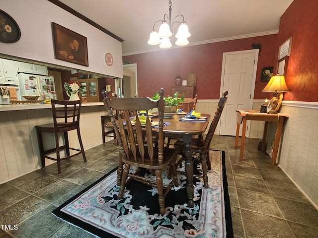 6517 Whitted Rd, Fuquay Varina, NC 27526 - dining space featuring a chandelier, ornamental molding, and a wainscoted wall