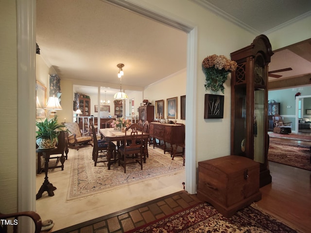 6517 Whitted Rd, Fuquay Varina, NC 27526 - dining area with crown molding, a ceiling fan, and a chandelier
