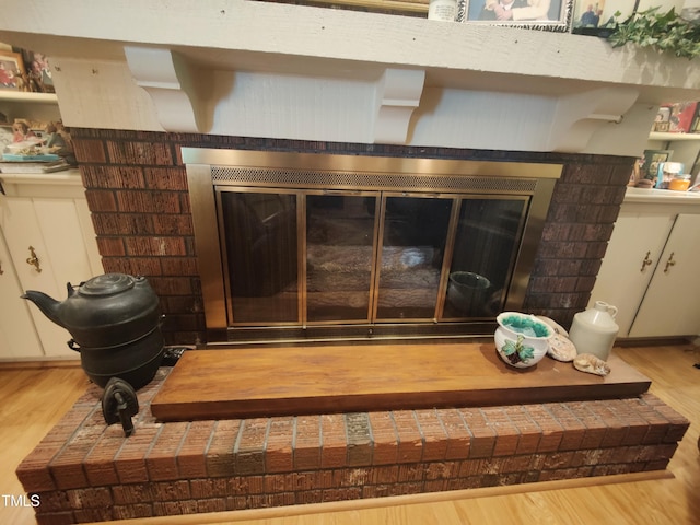 6517 Whitted Rd, Fuquay Varina, NC 27526 - detailed view of wood finished floors and a brick fireplace