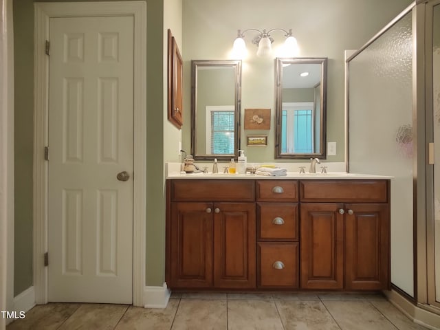 6517 Whitted Rd, Fuquay Varina, NC 27526 - bathroom featuring double vanity, a stall shower, and tile patterned flooring