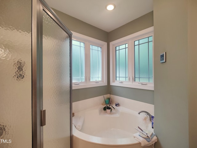 6517 Whitted Rd, Fuquay Varina, NC 27526 - bathroom with a garden tub and a shower stall