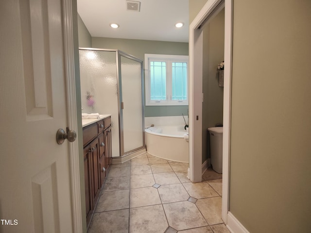 6517 Whitted Rd, Fuquay Varina, NC 27526 - full bathroom with a shower stall, a bath, vanity, tile patterned floors, and recessed lighting