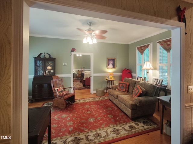 6517 Whitted Rd, Fuquay Varina, NC 27526 - living area featuring wood finished floors, a ceiling fan, and crown molding