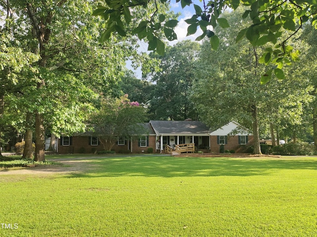 6517 Whitted Rd, Fuquay Varina, NC 27526 - ranch-style house featuring a front lawn and brick siding