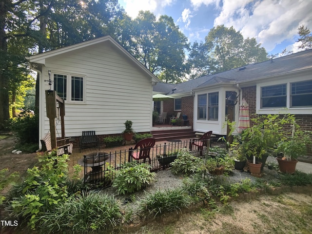 6517 Whitted Rd, Fuquay Varina, NC 27526 - rear view of house with a deck and a patio area