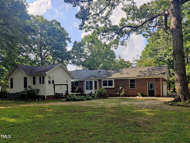 6517 Whitted Rd, Fuquay Varina, NC 27526 - rear view of house with a yard and brick siding