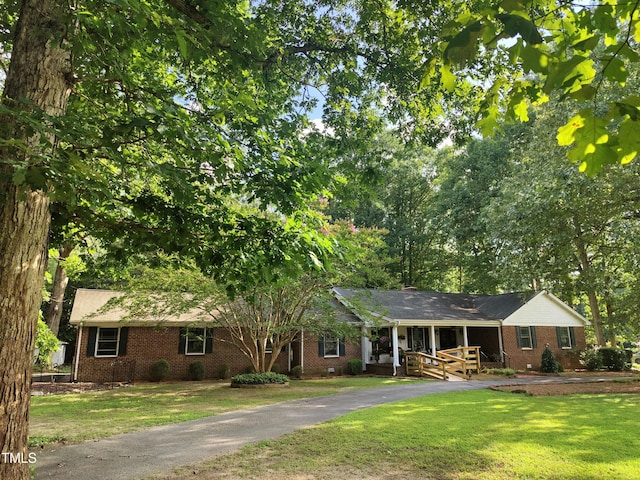 6517 Whitted Rd, Fuquay Varina, NC 27526 - single story home with brick siding and a front lawn